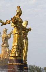 Fototapeta na wymiar Girl with a fountain of friendship Kazakhstan