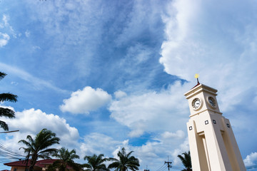 white clock tower under the skies