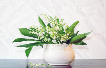 Basket with lilies of the valley 