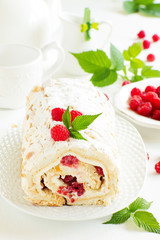meringue roulade with cream and raspberries