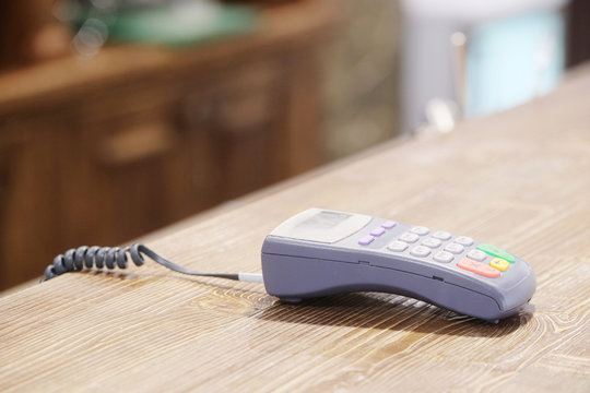The image of a plastic card reader on a counter