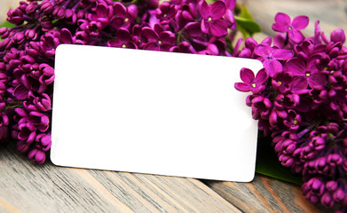 Lilac flowers with empty card