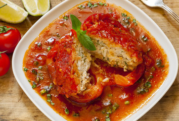 Bell peppers stuffed with meat, rice  and sauce on plate, select