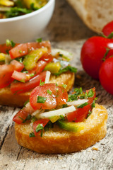 Italian bruschetta with tomato, onion and bell 
