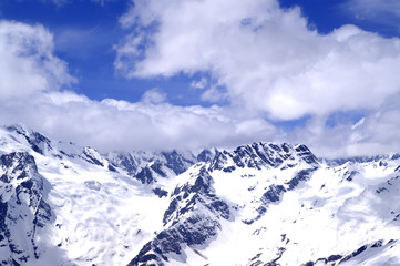 Fototapeta na wymiar Snowy mountains in sun day