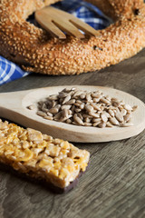 Seeds in Wooden Spoon Spread on Wood Background with Table Cloth
