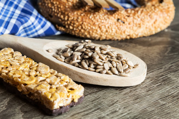 Seeds in Wooden Spoon Spread on Wood Background with Table Cloth