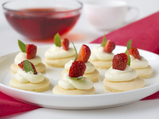 biscuits with whipped cream, strawsberry, mint