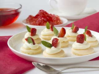 biscuits with whipped cream, strawsberry, mint