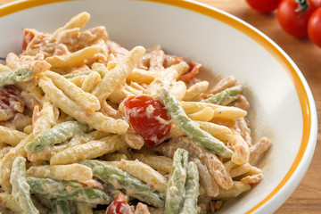 multi colored pasta called trofie with salmon