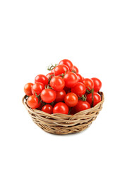 Cherry tomatoes in a basket isolated on white