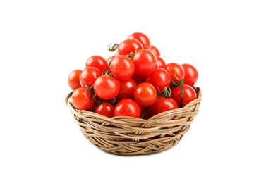 Cherry tomatoes in a basket isolated on white