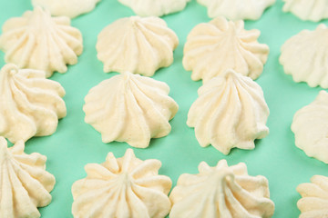 French meringue cookies on green background