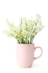 Lily of the Valley in cup on white background