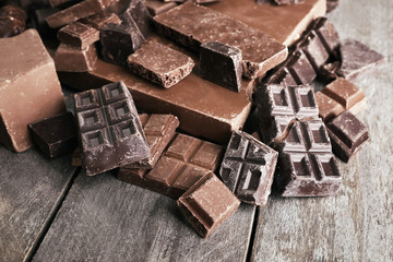 Set of chocolate on wooden table, closeup