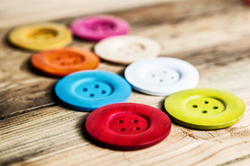 colored buttons on wooden board, Colorful buttons, on old wooden