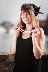 Flapper girl woman in1920s style portrait outdoor