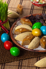 Novruz in Azerbaijan. Colored eggs for easter and traditional sweets