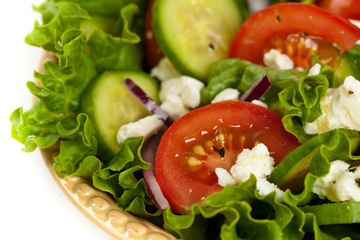 Salad with Feta Cheese on a white background. Selective focus.