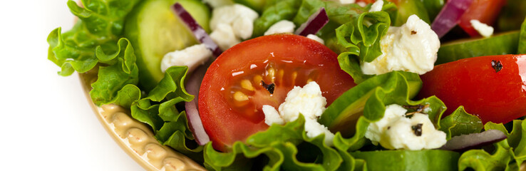 Salad with Feta Cheese on a white background. Selective focus.
