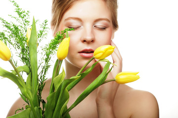 young smiling woman with yellow tulips