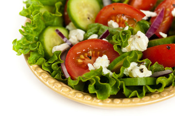 Salad with Feta Cheese on a white background. Selective focus.