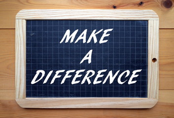 Te phrase Make A difference written on a blackboard - obrazy, fototapety, plakaty