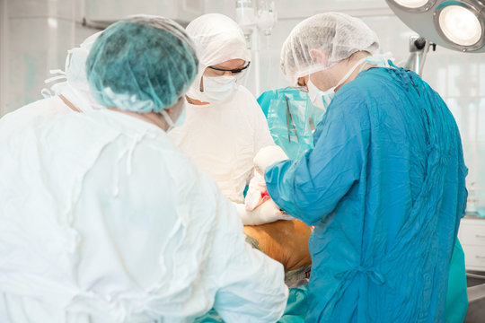 surgeons operating