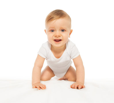 Sad looking baby crawling and wearing white body