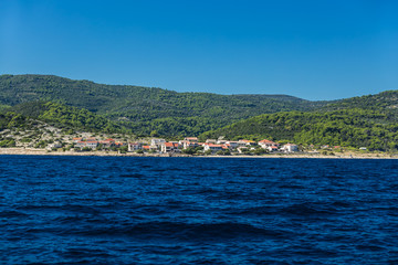Fototapeta na wymiar Small village on shore of Adriatic sea on Croatian island Brac.
