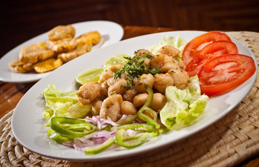 Delicious breaded calamari served with plantain chips