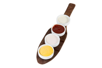 Obraz na płótnie Canvas Sauces in bowls isolated on white with mustard, ketchup, yogurt