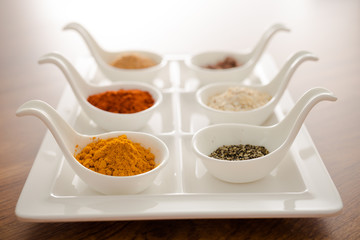 Wooden table of colorful spices
