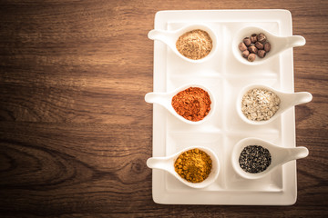 Wooden table of colorful spices