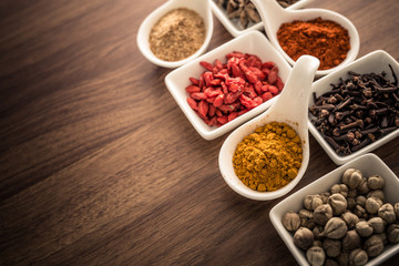 Wooden table of colorful spices