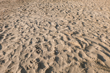 sea sand with footprints