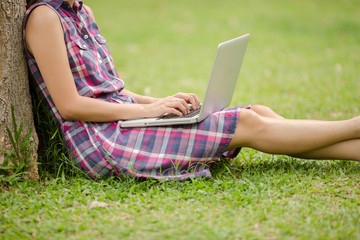 Young Caucasian woman using Laptop on nature