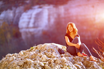 smiling woman in the rocks