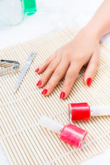 Obraz na płótnie Canvas Beautiful manicured woman's nails with red nail polish