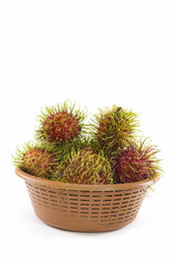 Rambutan Fruit with basket on white background