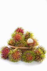 Rambutan Fruit with basket on white background