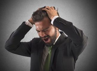 Confused businessman screams