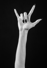 Fototapeta premium white hands of death with black nails, white death, white skin