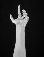white hands of death with black nails, white death, white skin