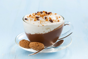 chocolate dessert with cream and amaretti in glass cup 