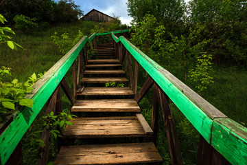 Old wooden ladder leading to the house