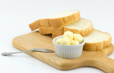 fresh butter in cup isolated