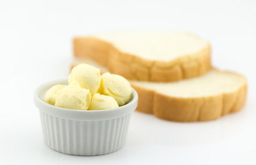 fresh butter in cup isolated