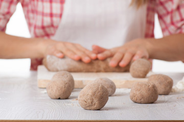 cook hands preparing dough
