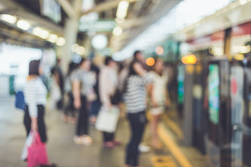 Blurred background : People stand at the sky train station, bang